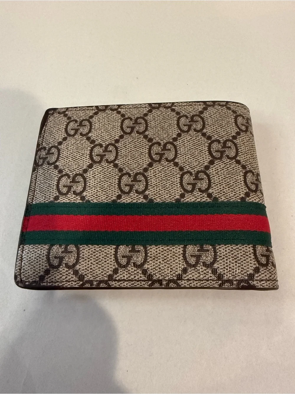 GUCCI Brown GG Supreme Canvas Bifold Wallet Pre-owned.